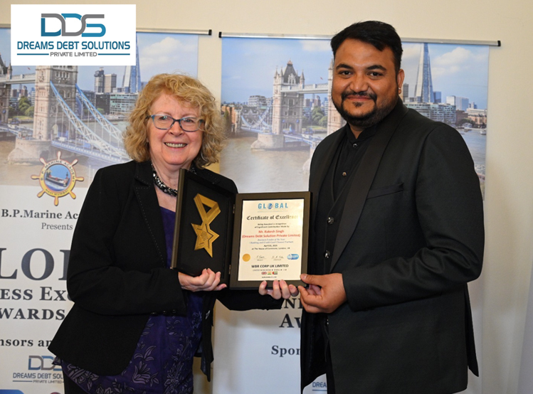 Mr. Rakesh Singh receiving the GBE award from Ms. Terry Marsh